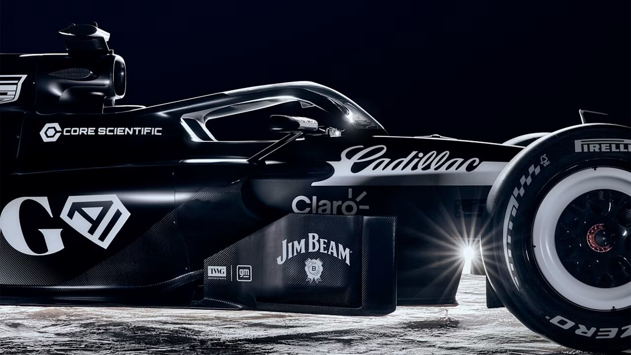 Cadillac Formula 1 race car at speed on a Grand Prix circuit